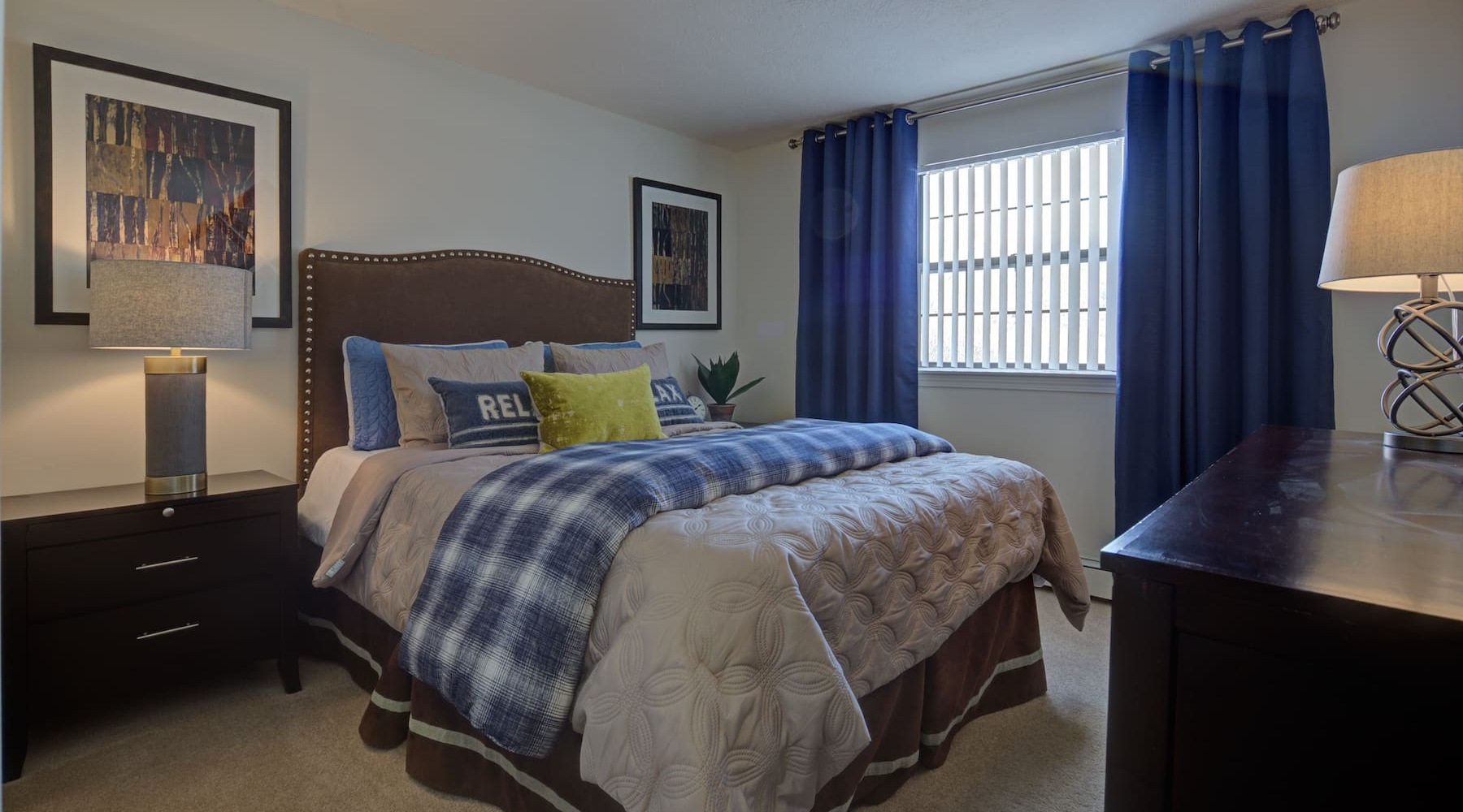 spacious bedroom with a large window